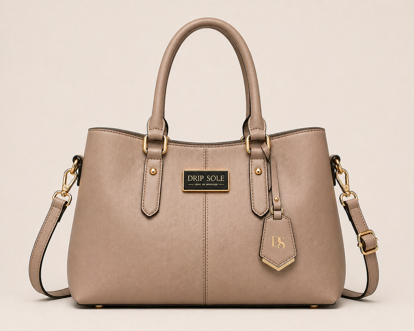 Beige handbag with gold accents on a beige background