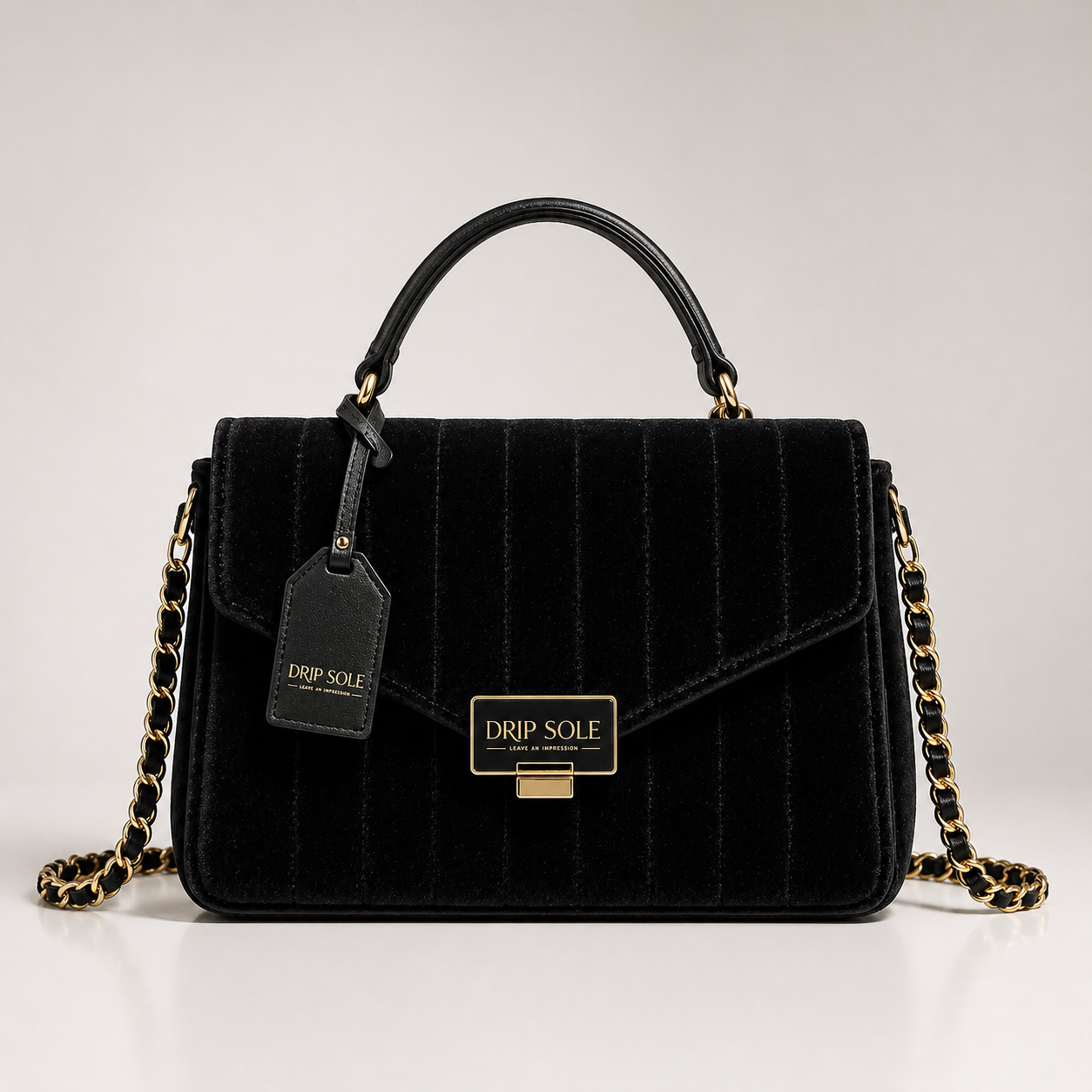 Black quilted handbag with gold chain and 'Drip Sole' tag on a light gray background