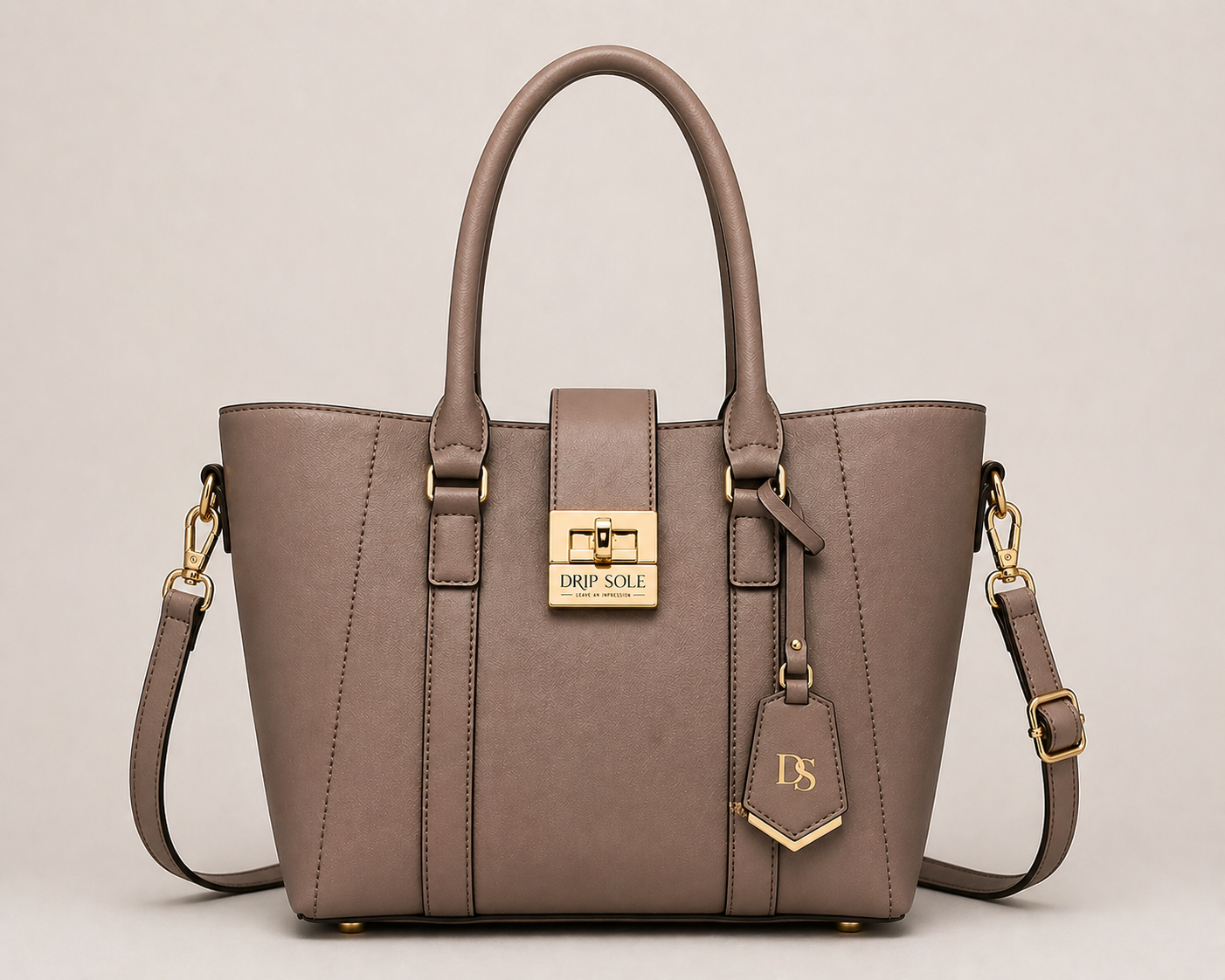 Brown handbag with gold accents on a beige background