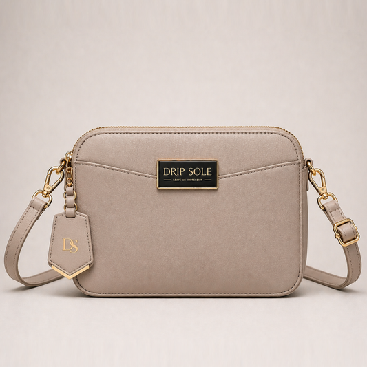 Beige handbag with gold accents on a light beige background